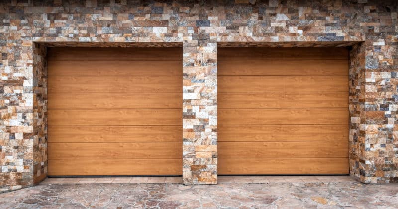 Modern and luxurious double garage with driveway and roller door