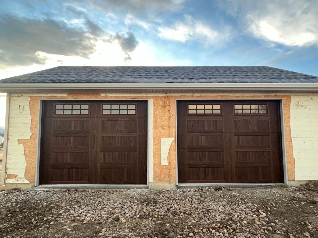 Pair of dark oak garage doors in Berthoud, CO