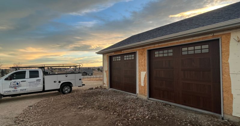 Two Amarr Garage Doors with the PNG Garage Doors truck near Berthoud, Colorado.