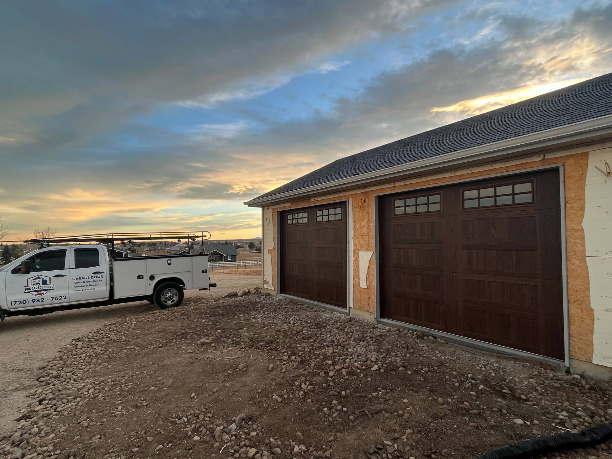Two Amarr Garage Doors with the PNG Garage Doors truck near Berthoud, Colorado.