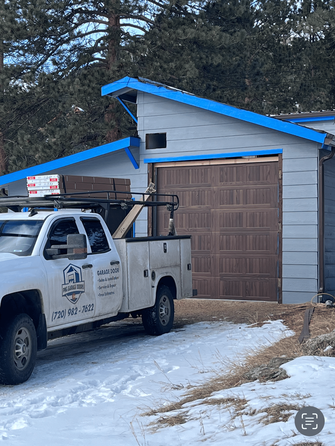 PNG Truck completing a garage door replacement in Colorado